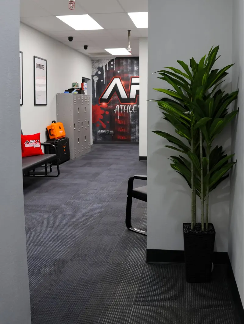 The APX lobby, with seating and lockers in front of the APX mural